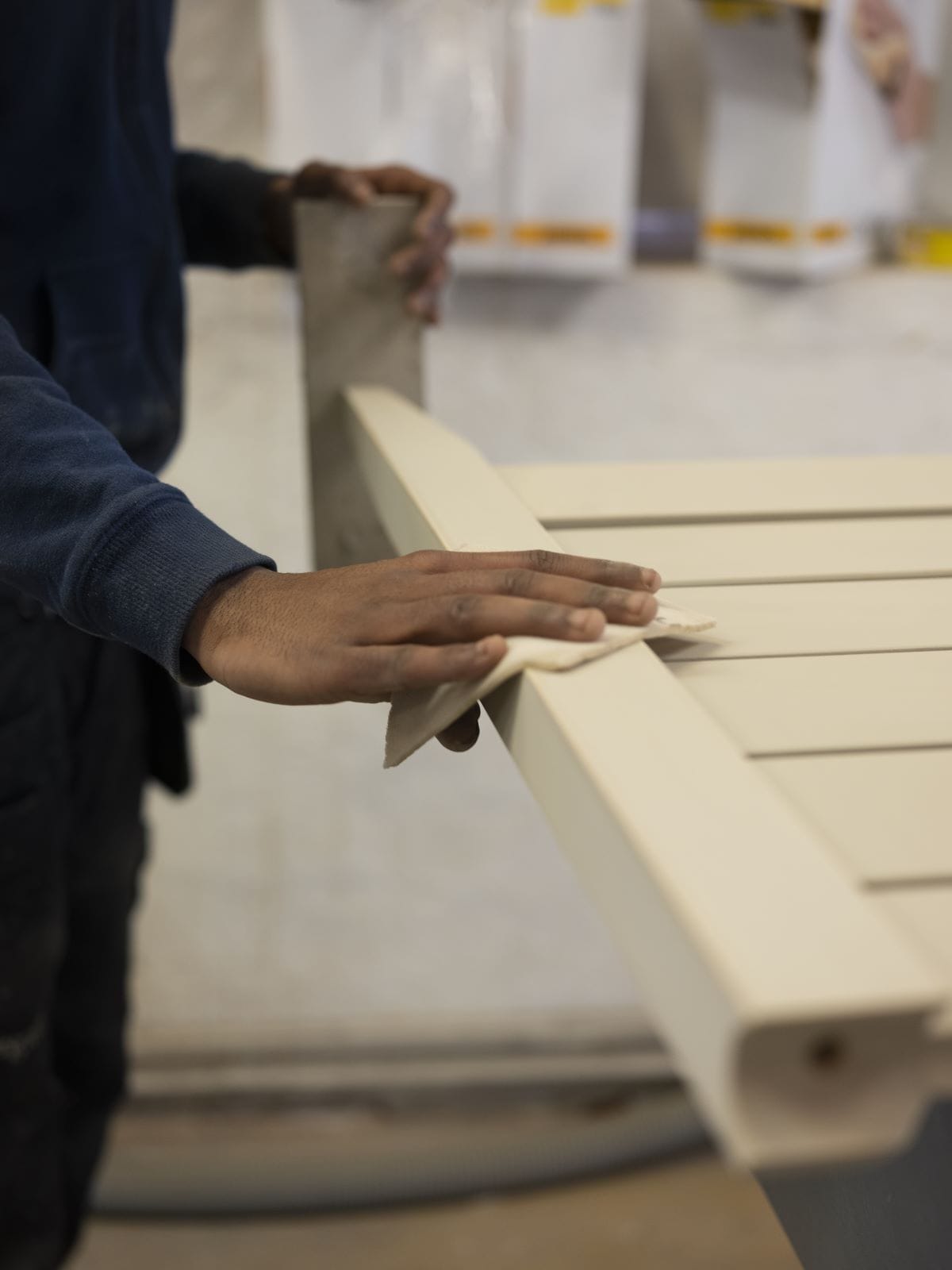 a man is sanding a chair