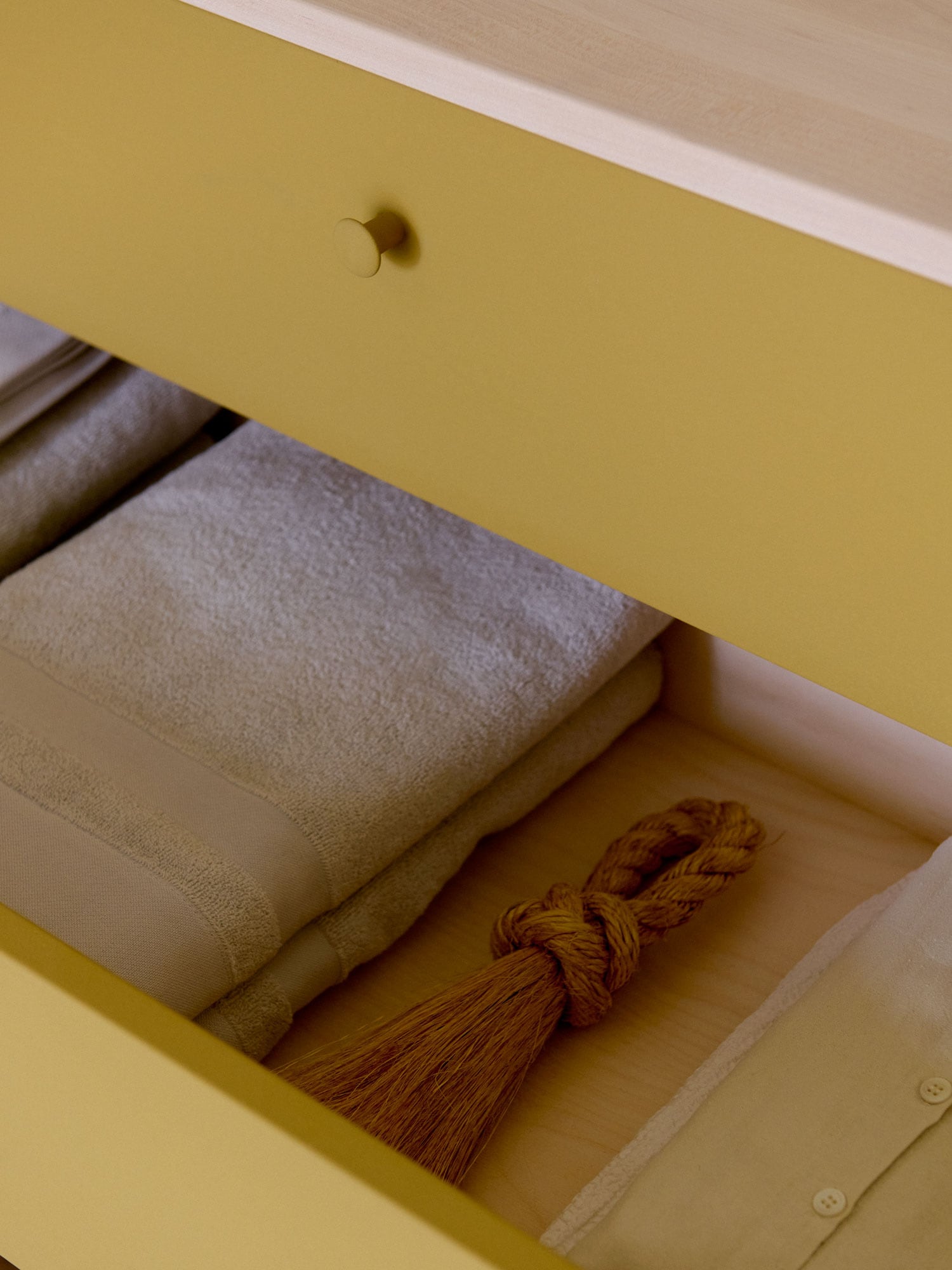 drawn-out drawer on a chest of drawers