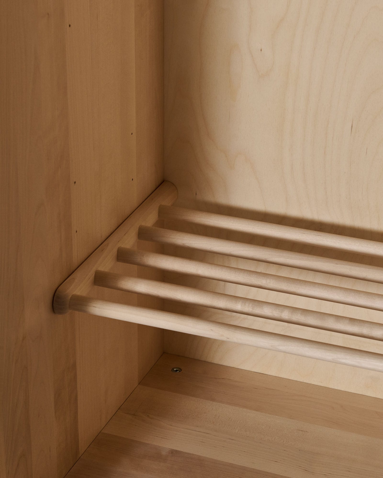 shoe rack in solid birch inside a cupboard