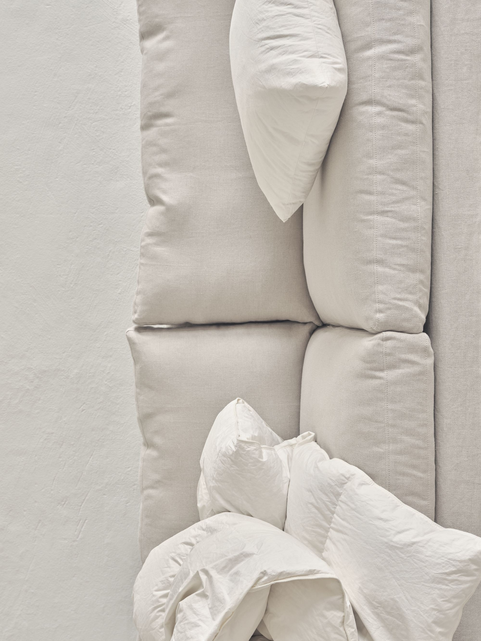 sofa with pillows and blankets